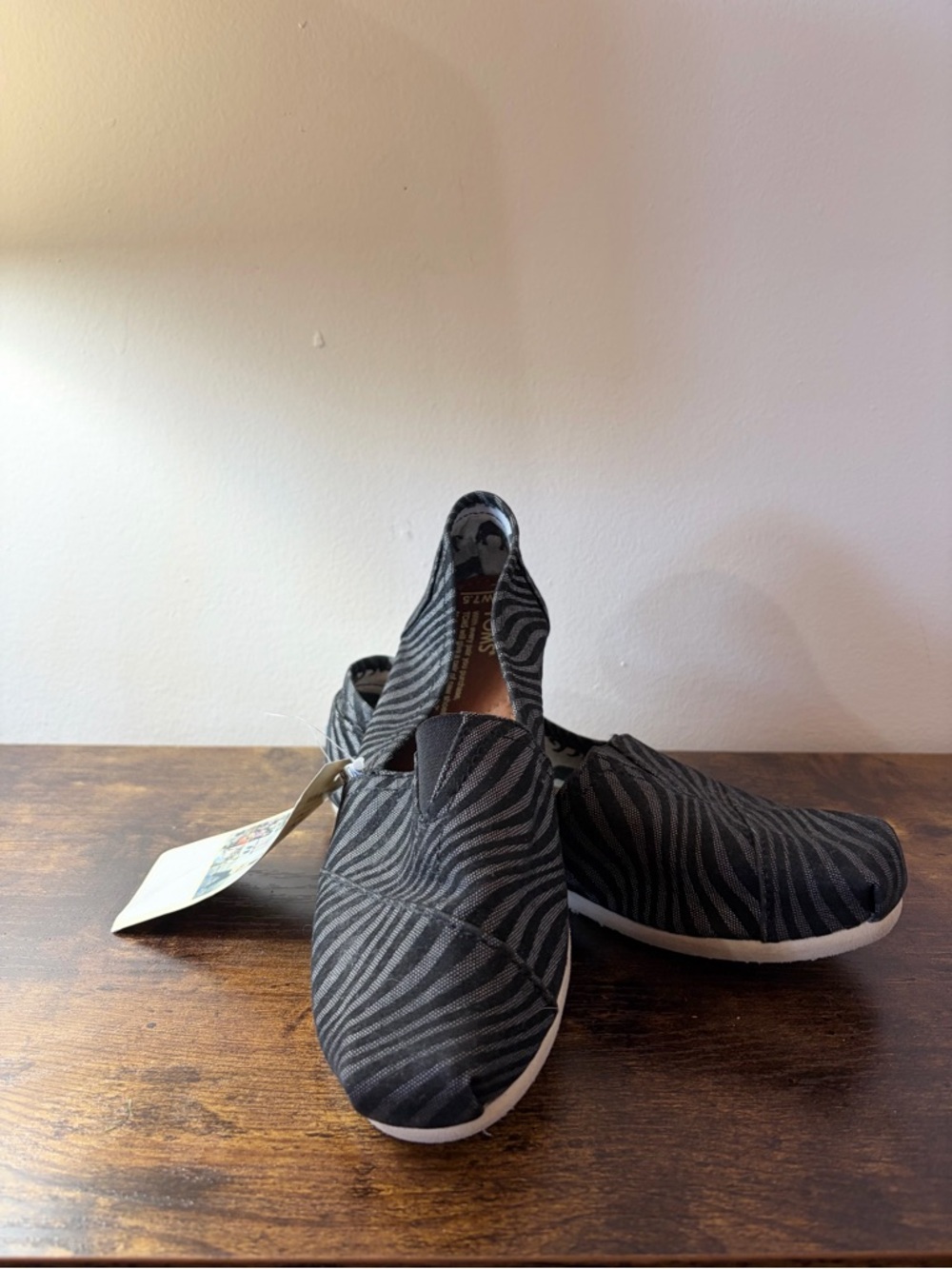 Toms Black and Gray Patterned Slip-On Shoes